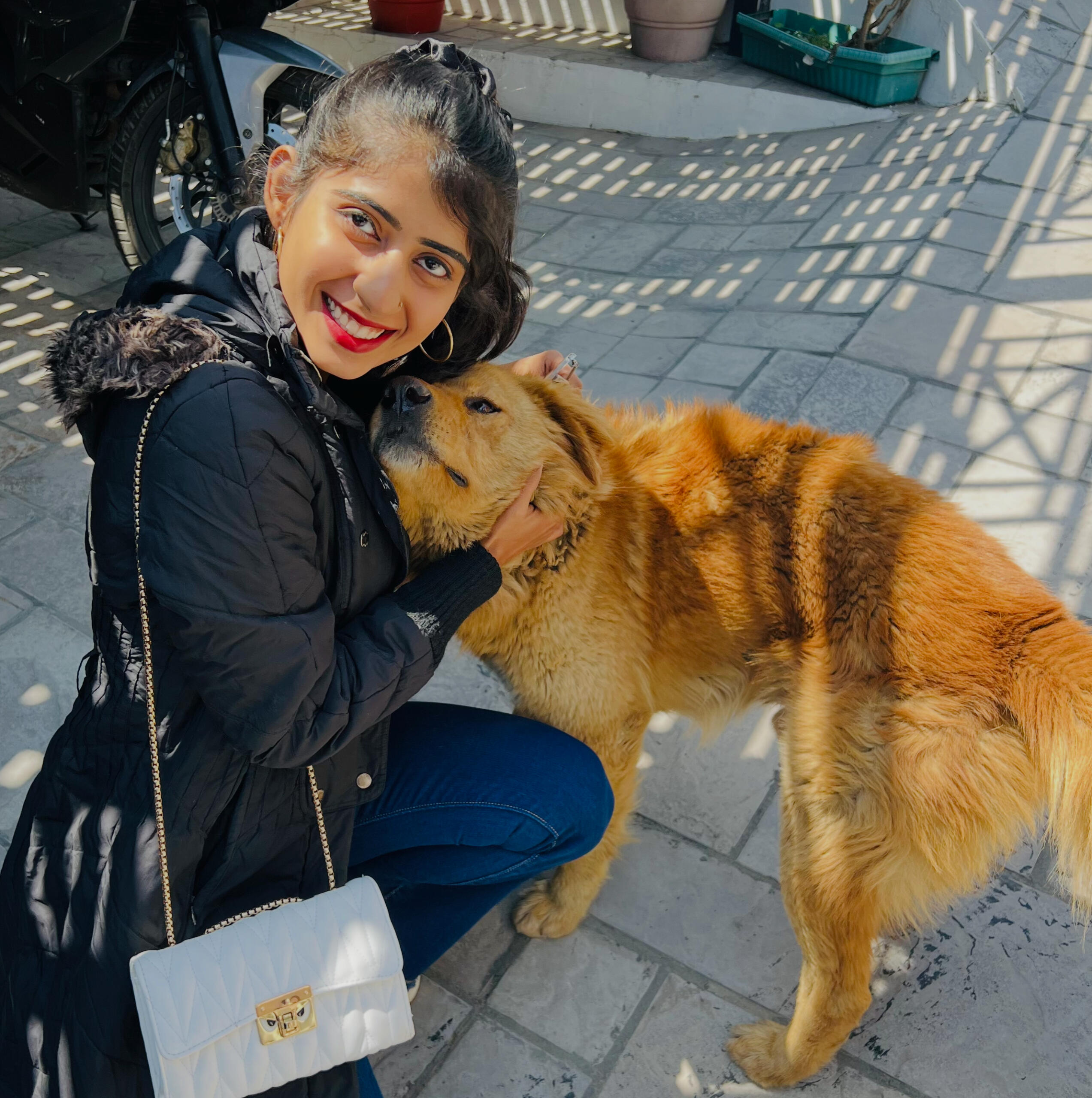 Intuitive animal communicator Suhani Tuteja with a rescued dog